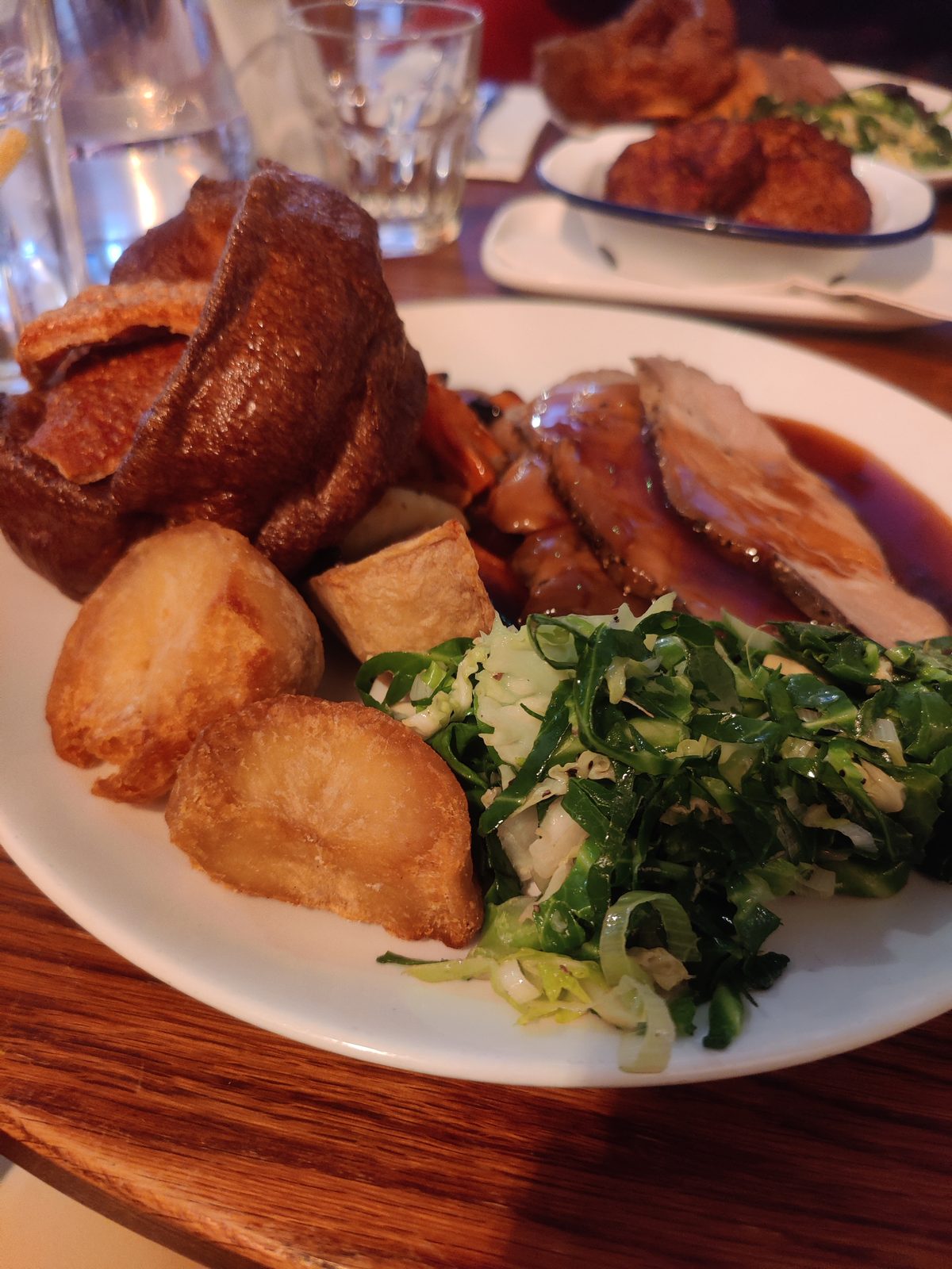 Roast dinner with crispy potatoes and greens